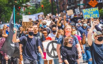 cell phone video captures image of crowd of peaceful protest march