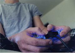 man playing a video game image link to story
