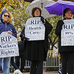 Women holding up signs image link to story