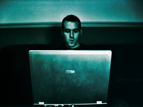 Young man staring at a computer screen