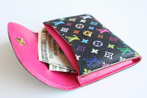 Wallet with a 10 dollar bill inside image link to story