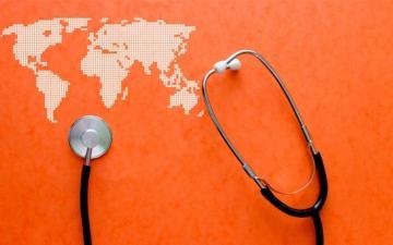 Stethoscope and world map