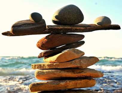 Photo of rocks balanced on each other on a beach
