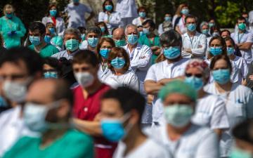 crowd of healthcare workers wearing medical mask