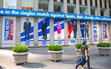 Promotional posters outside Fox News studios at News Corporation headquarters in New York. (AP Photo/Ted Shaffrey) image link to story