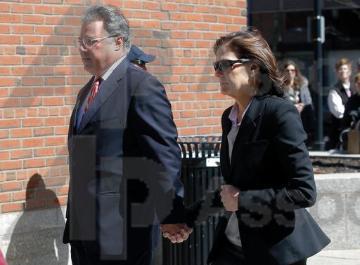 Manuel and Elizabeth Henriquez arrive at federal court in Boston on Wednesday, April 3, 2019, to face charges in a nationwide college admissions bribery scandal. (AP Photo/Steven Senne).