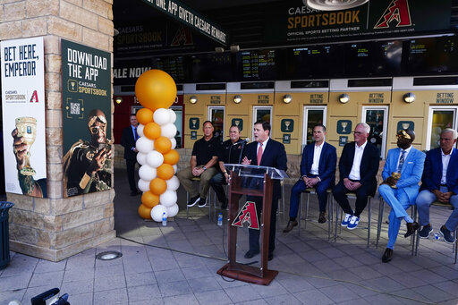Arizona Republican Gov. Doug Ducey speaks at a news conference as the Arizona Diamondbacks partner with Caesars Entertainment setting up temporary betting windows at the Diamondbacks' Chase Field, Thursday, Sept. 9, 2021, in Phoenix. Ross D. Franklin/Associated Press image link to story