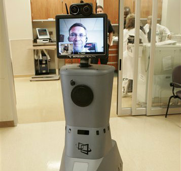 The RP-7 remote presence robotic system at St. Joseph Mercy Hospital in Pontiac, Mich. makes the hospital's specialists available around the clock to any hospital in the state. (AP Photo/Paul Sancya)