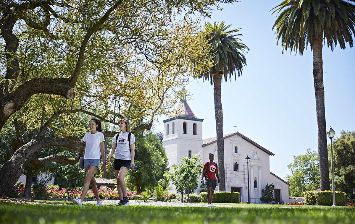 Students walking in front of Mission church on campus