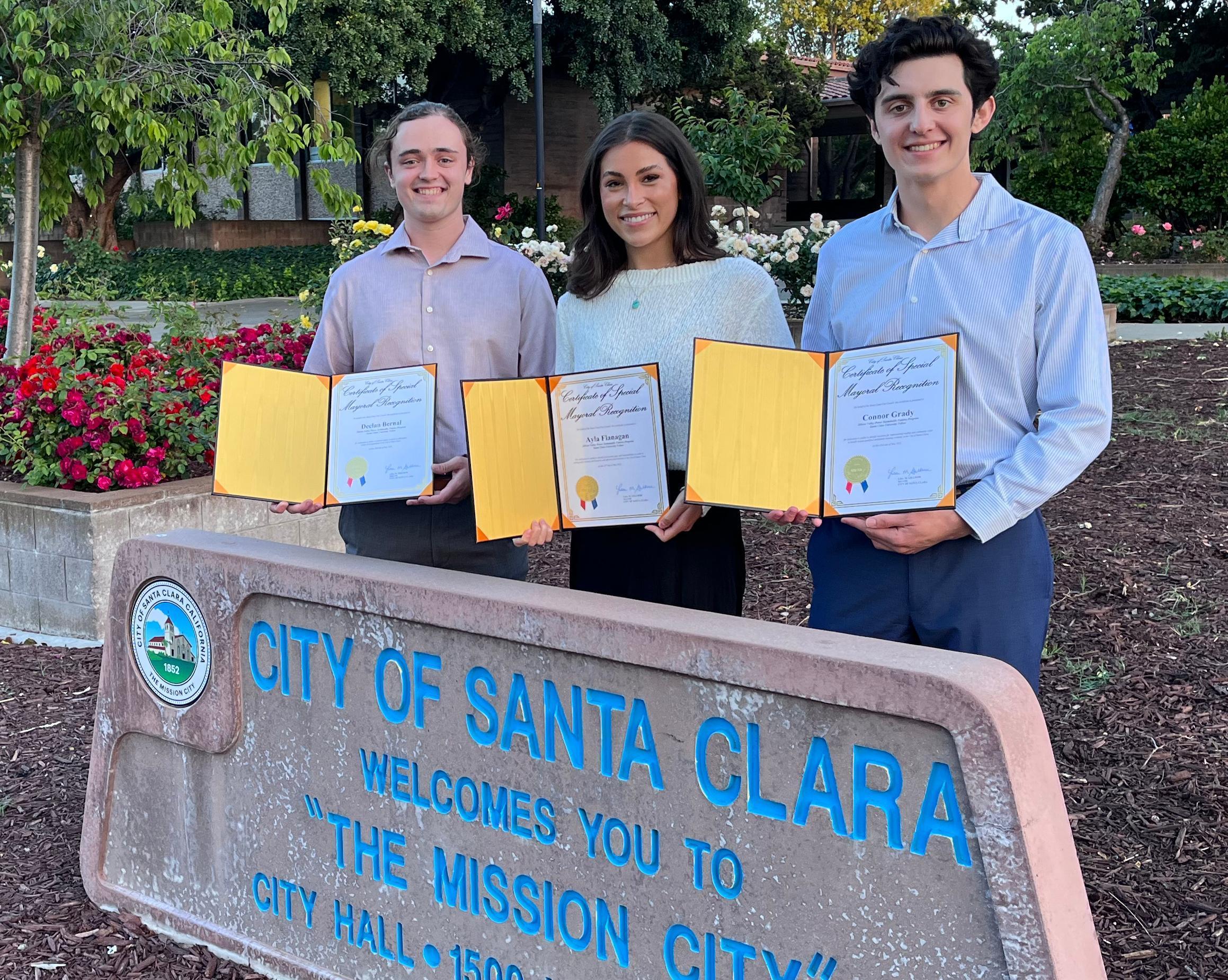 SVP fellows by Santa Clara city hall holding awards 