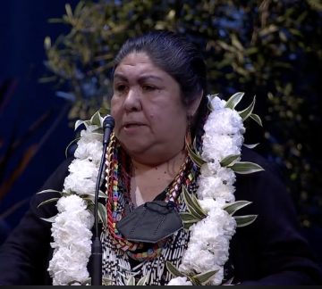 close up of Indigenous speaker Corinna Gould with flower lei
