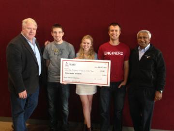 Student winners holding a big check posing with Professor Christopher Kitts and Dean Godfrey Mungal