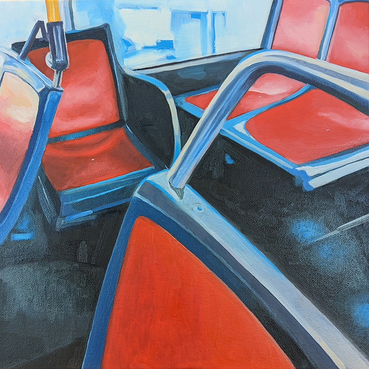 empty red seats in a bus