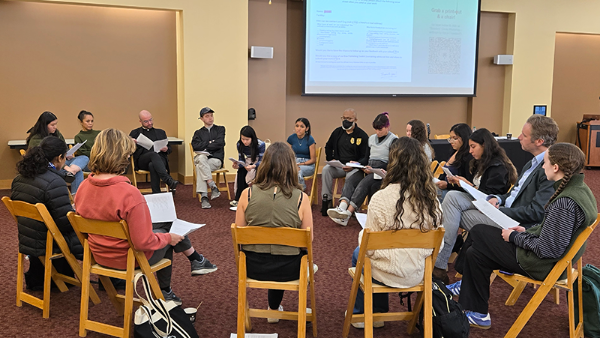 Students, staff and faculty participate in a Readers' Circle workshop with panelists and prison organizers.