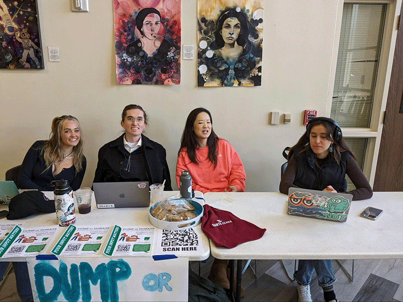 four students tabling