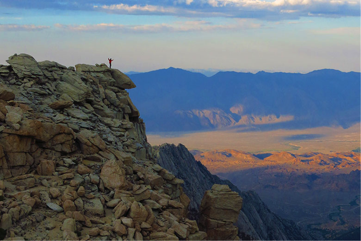 ESS Senior Sean Reilly takes in the view from high in the Eastern Sierra. Mix and Reilly are developing climate records to determine if the southern Sierra rose more recently than the north side and explore the interaction between uplift and changes in atmospheric circulation. image link to story