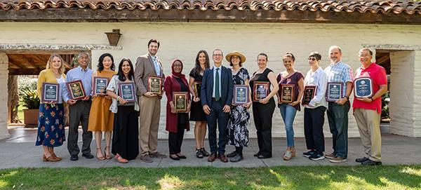 Group picture of all the 2021 award winners and Daniel Press image link to story