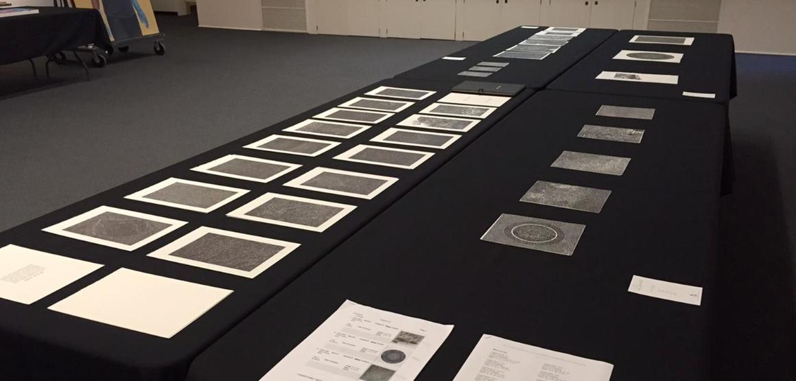 Bruce Conner prints laid out for consideration during a Collections Committee meeting.