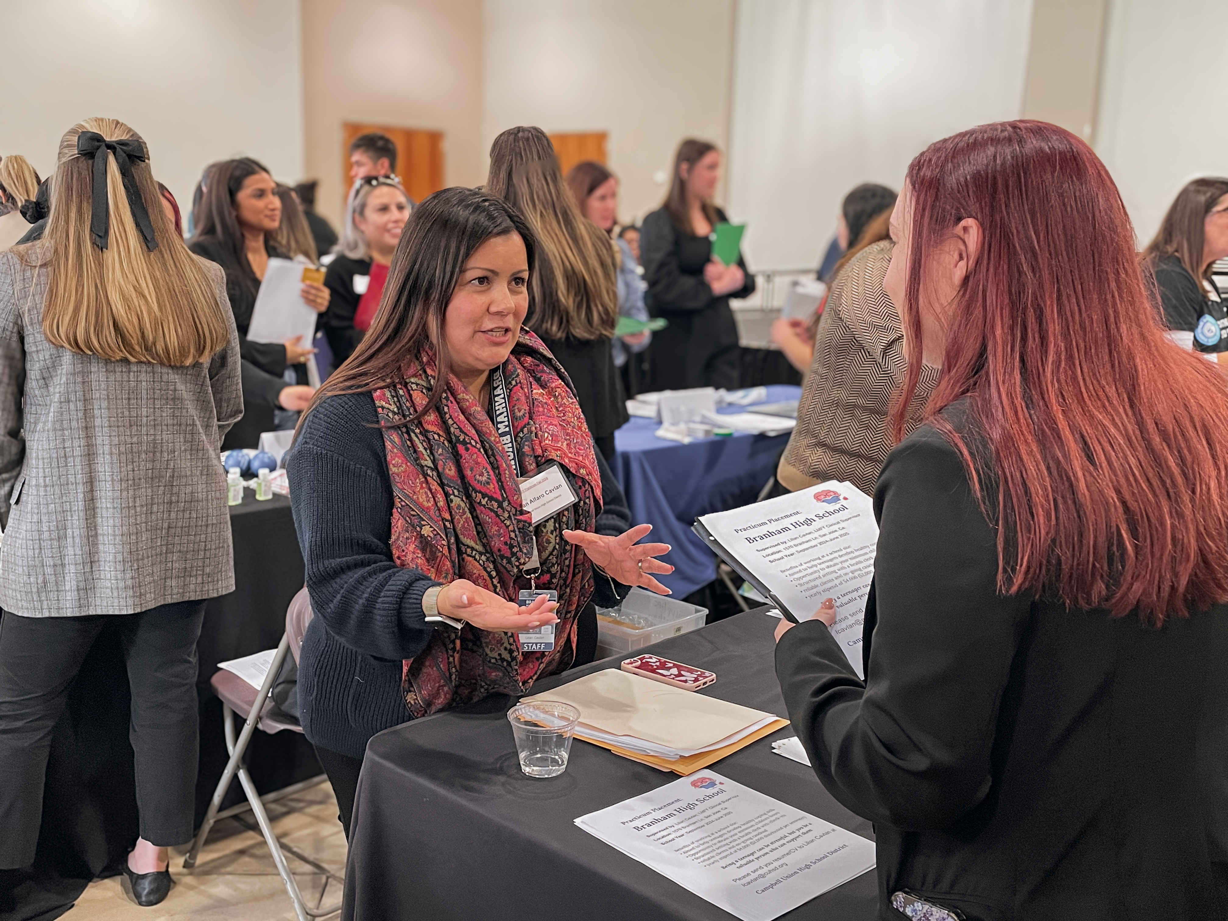 A CPSY student learns more about a practicum placement at the 2024 Counseling Psychology Practicum Fair.