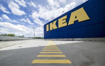 Empty garage with a highlighted walking path in front of an IKEA. image link to story