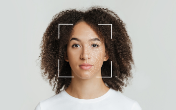 Biometric Facial Recognition of Expressionless Young African American Female. Photo by Prostock Studio via Canva for Education.