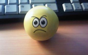 Stressball with angry expression.