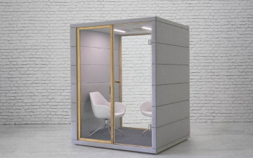 A picture of a meeting cube with chairs inside
