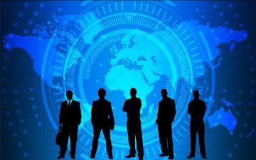 silhouette of five business people with world map image in the background image link to story