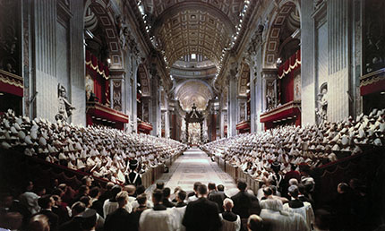 Interior of a grand cathedral filled with people during an event.