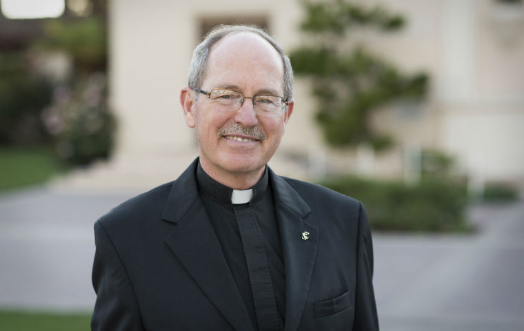 President Michael Engh, S.J., in clerical collar image link to story
