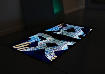 Projection of data center images on the floor at Data Shadows by AnnieLaurie Erickson