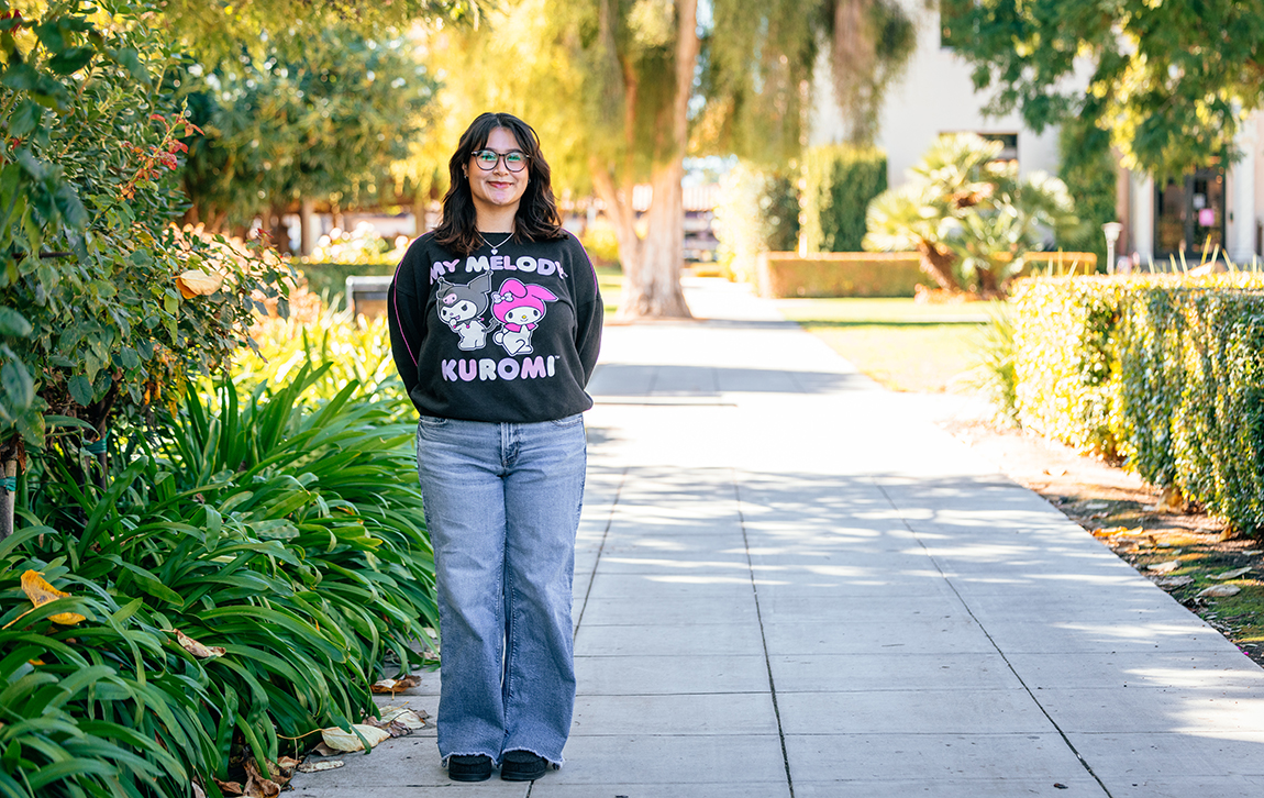 Angela Solorzano standing on walkway near Mission Gardens