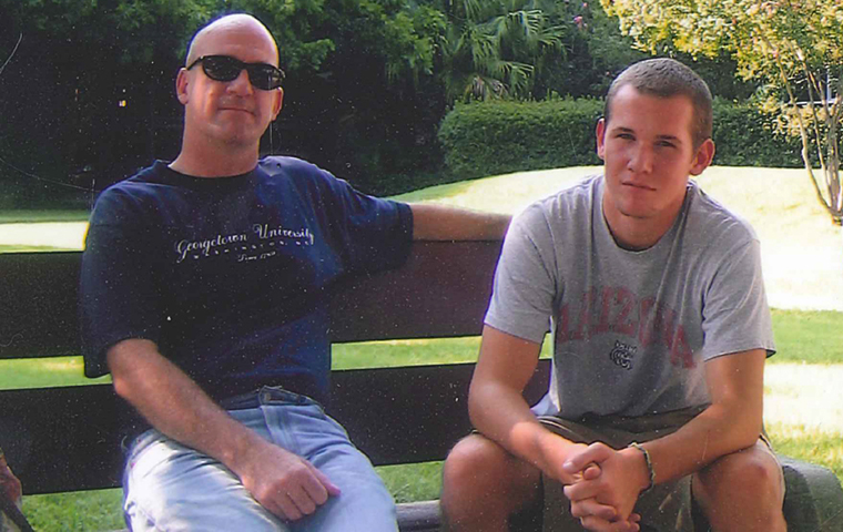 Father and Son: Eric and Chris Gregory sit on a bench