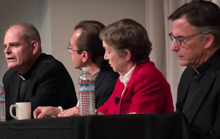 Fr. Brendan McGuire, left, speaks during an Oct. 9 panel discussion at Santa Clara University. Other panelists included, from left: Thomas Plante; Sally Vance-Trembath; and Jesuit Fr. Kevin O'Brien.