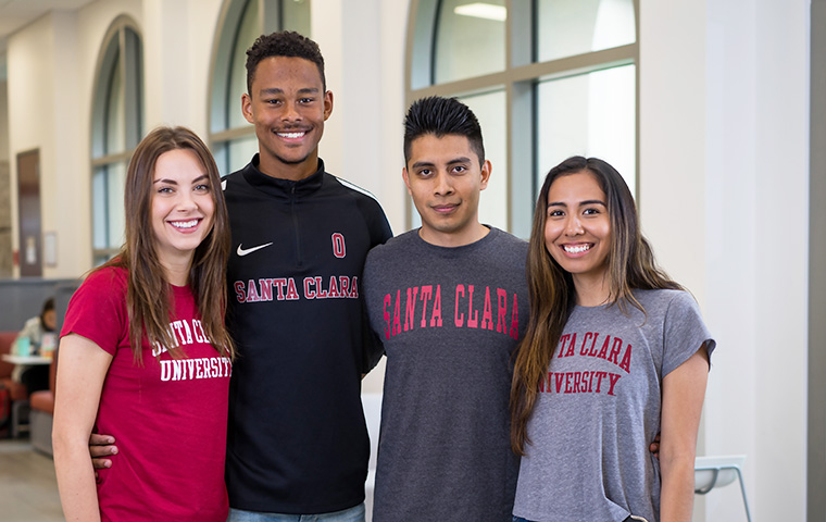 Students wearing SCU shirts posing on campus