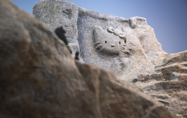 Hello Kitty's face carved into the side of a mountain