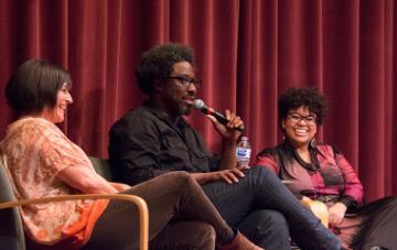 W. Kamau Bell with his wife (left) Melissa Hudson Bell '01 and assistant professor Danielle Morgan on stage at Mayer Theatre.