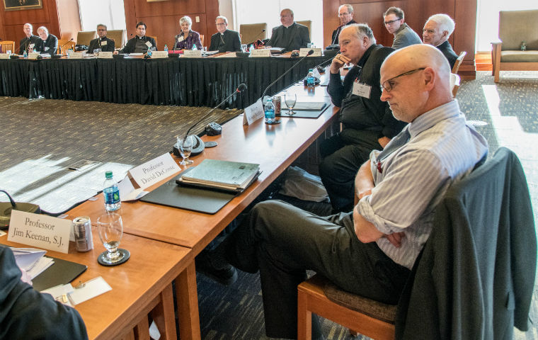 Priests and theologians around the table at Feb. 22 meeting of bishops and theologians image link to story