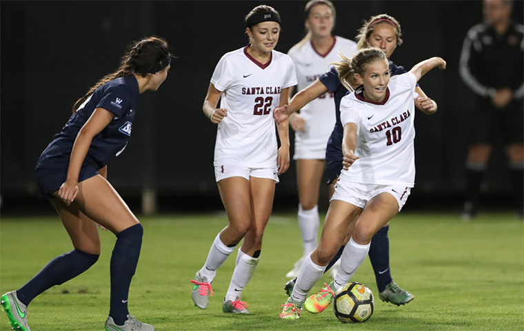 Kelsey Turnbow dribbles a soccer ball in a game  image link to story