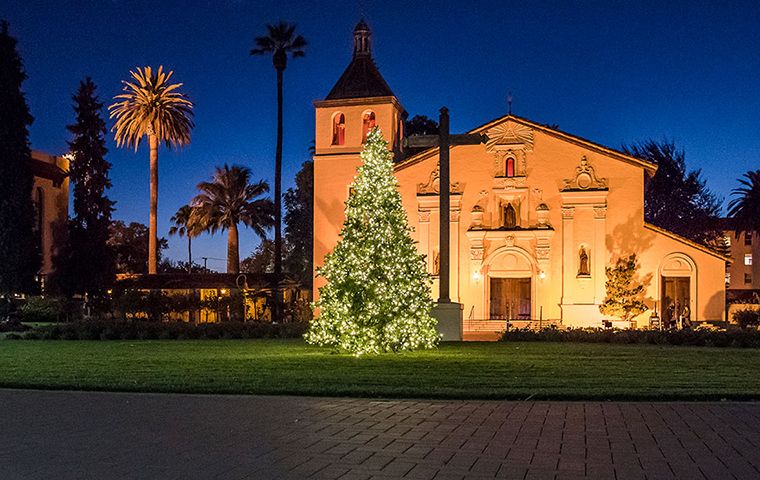 Christmas tree lit up in front of Mission Church on SCU campus
