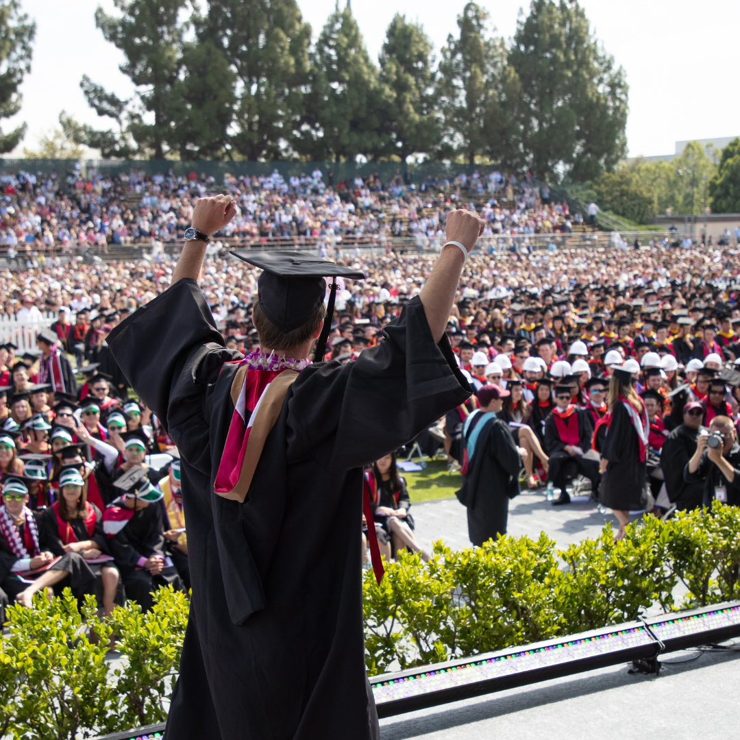 Student walking across the graduation stage 