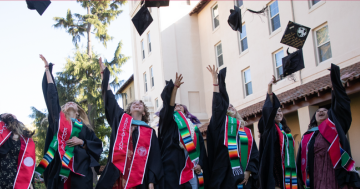 seniors toss their graduation caps into the air 