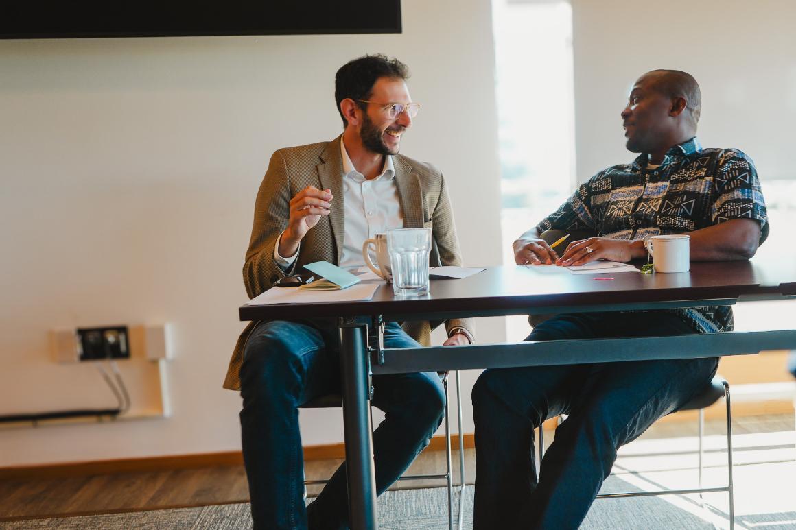 A student and faculty member talking 