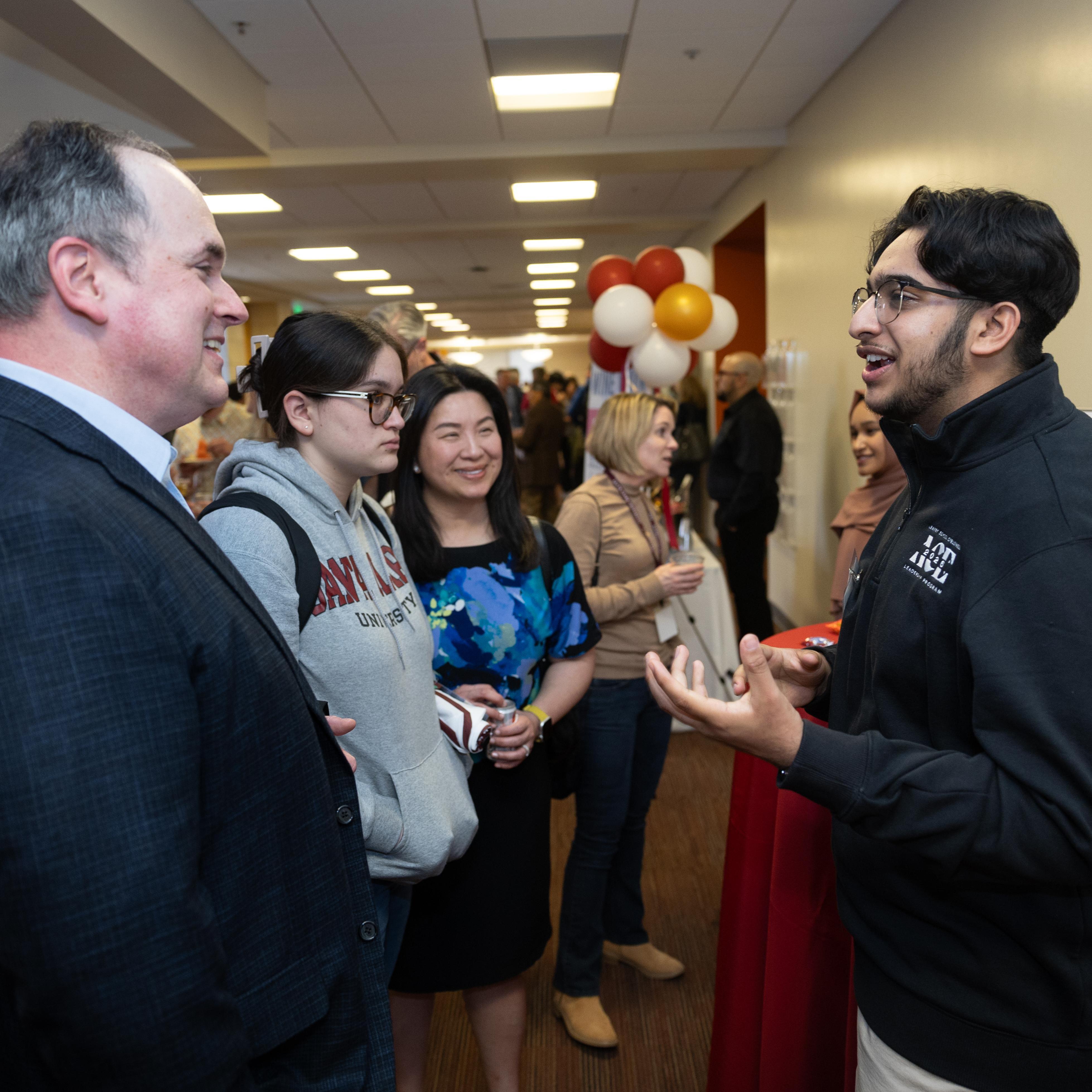 ACE student explaining the program during Family Weekend 