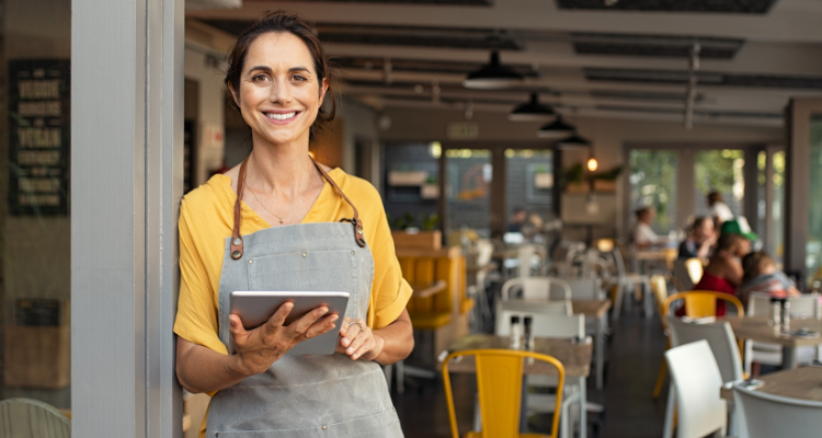 Photo of female cafe owner image link to story