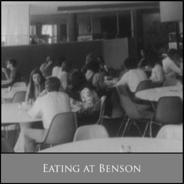 People seated and eating in Benson dining hall.