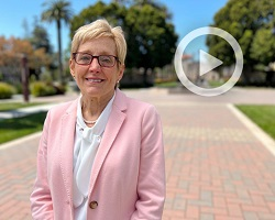 President Sullivan with the Mission Church in the distant background.