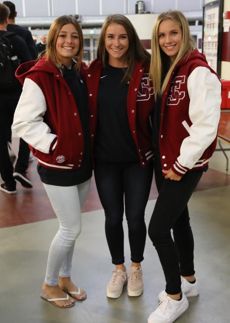 Soccer athletes wearing letterman jackets