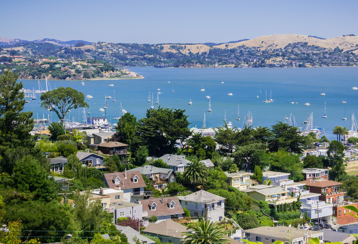 View of houses and boats on the water in bay area
