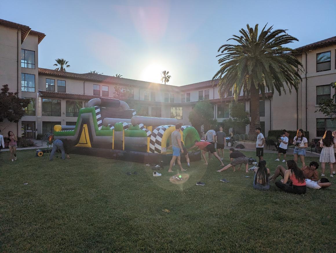 Residents outside with a bounce course